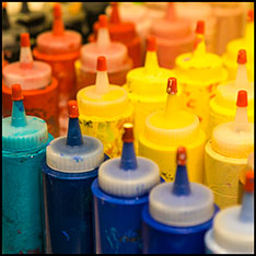 An image of paint bottles